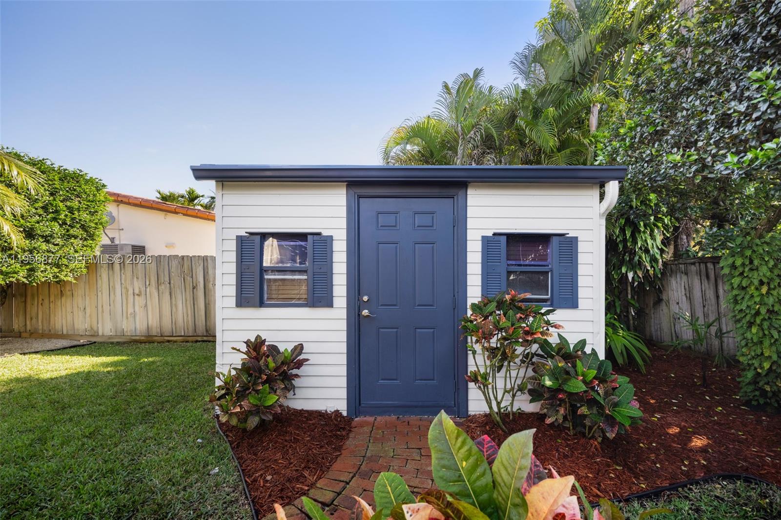 5730 Southwest 56th Terrace Miami, FL 33143 - Photo 17 of 18 a front view of a house with garden