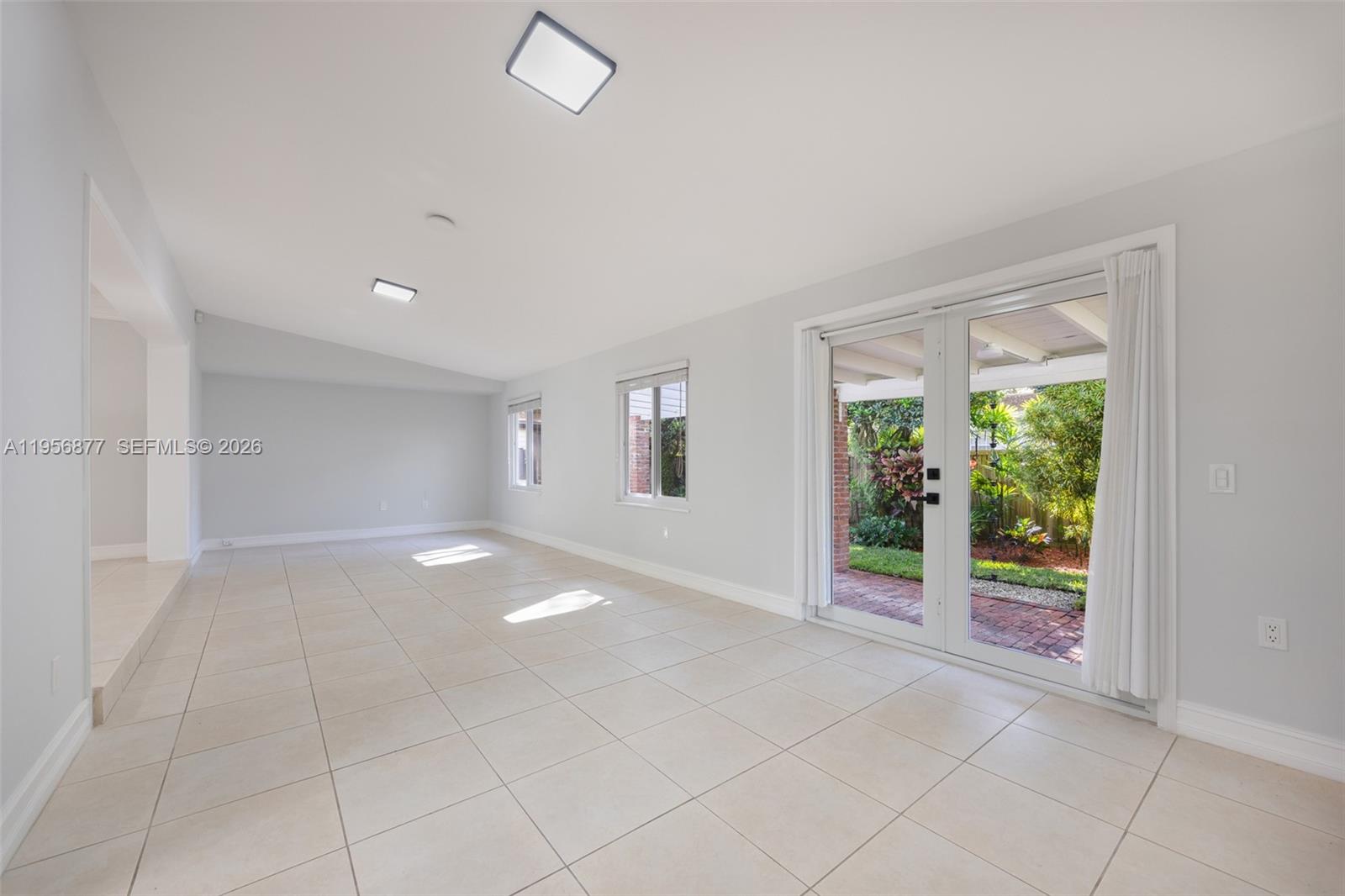 5730 Southwest 56th Terrace Miami, FL 33143 - Photo 6 of 18 an empty room with windows
