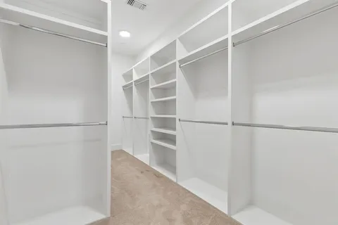 a view of an empty walk in closet