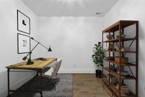 a view of a workspace with furniture
