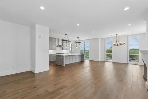 a view of kitchen with refrigerator and window