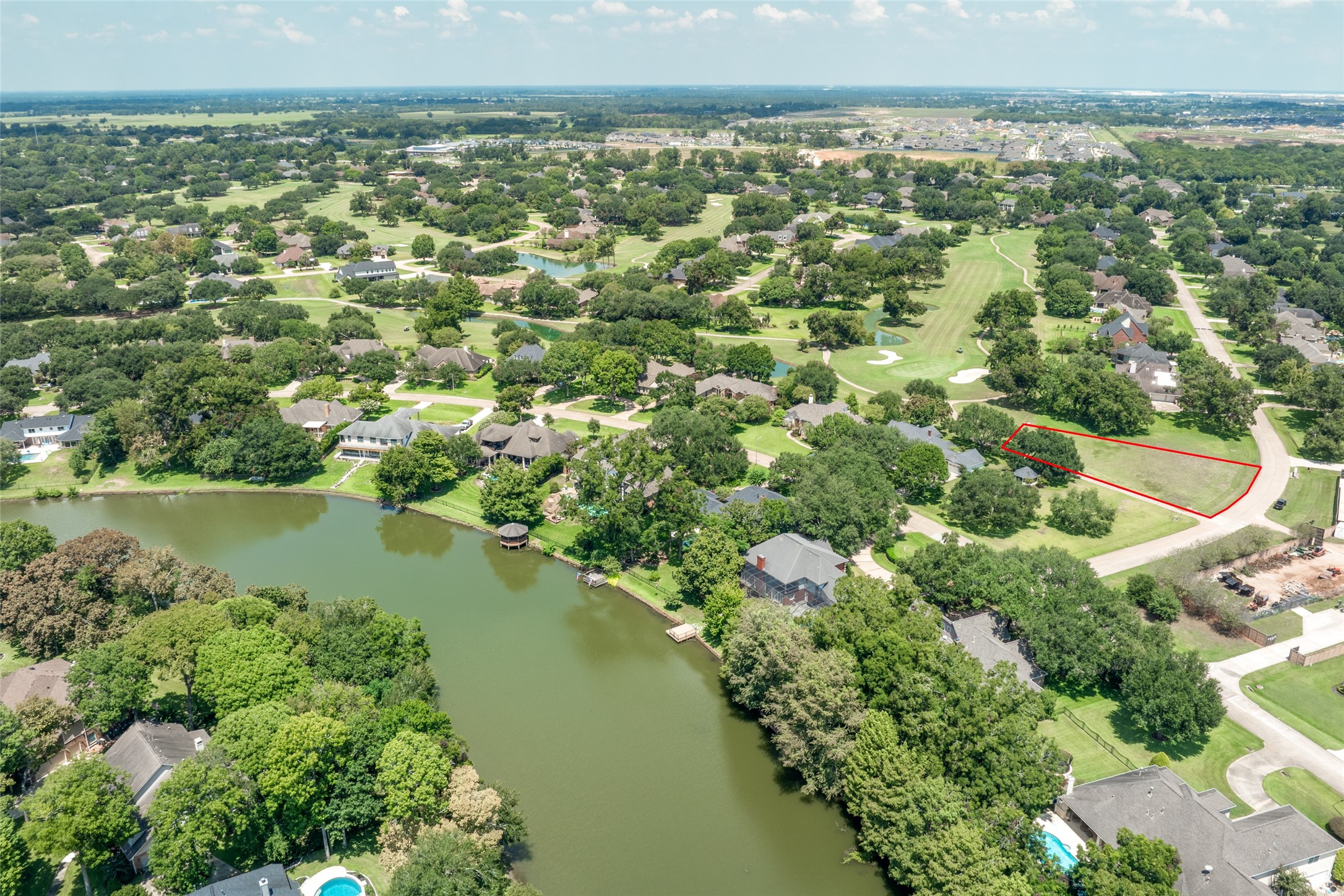 5303 Windrush Street Fulshear, TX 77441 - Photo 10 of 21 a view of a lake with a city
