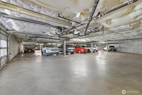 a view of parking space with parked cars