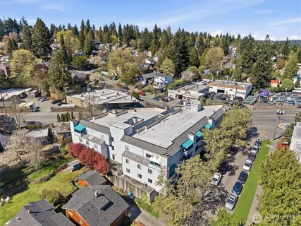 an aerial view of a house with a swimming pool