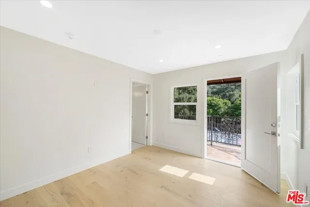 a view of a big room with windows and yard