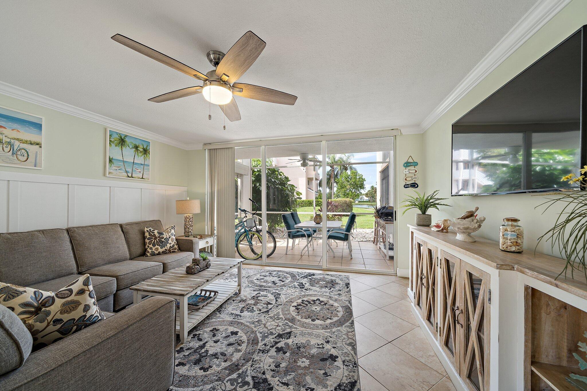 353 Highway 1, Unit D101 Jupiter, FL 33477 - Photo 13 of 32 a living room with furniture and a large window