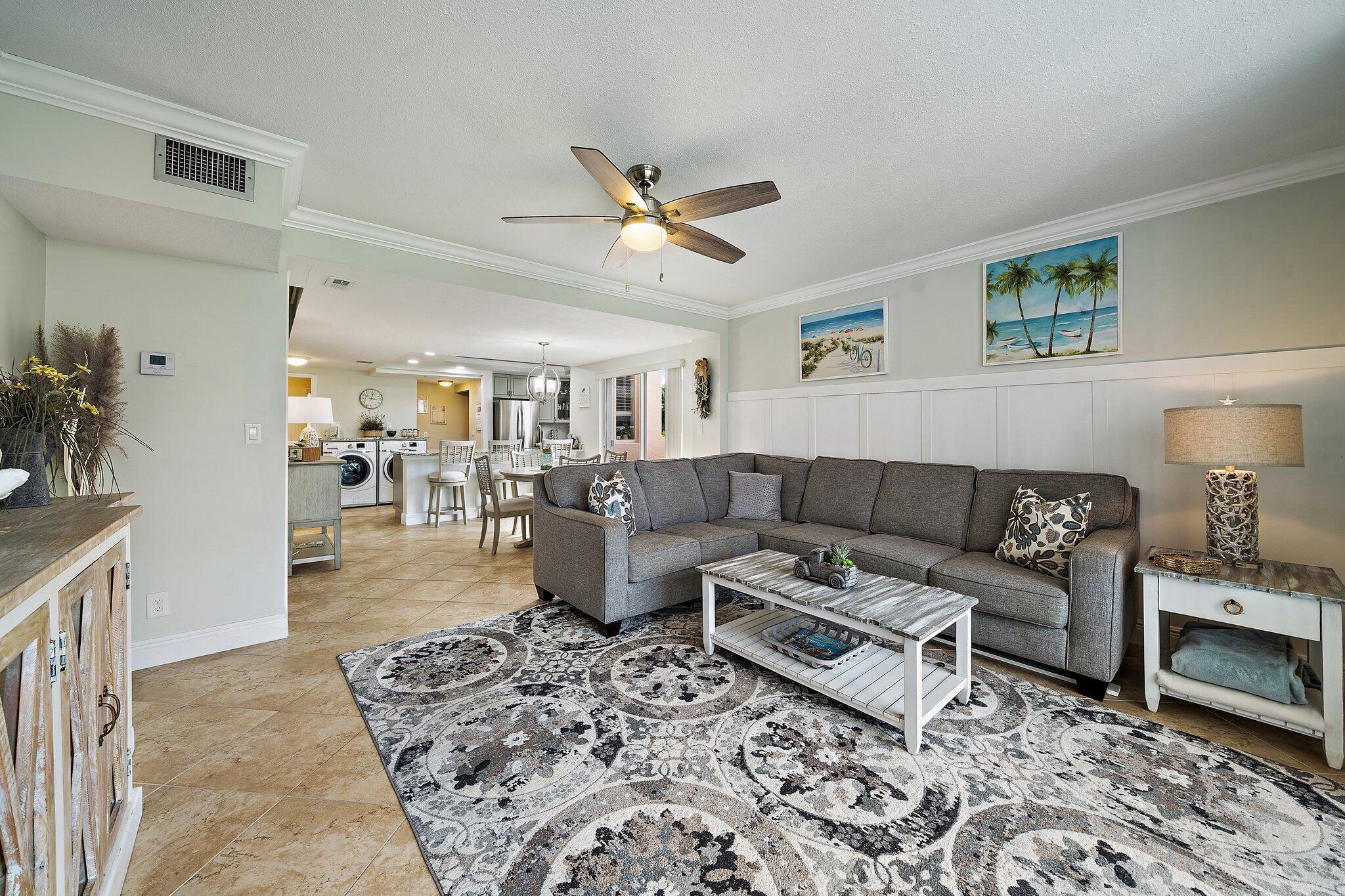353 Highway 1, Unit D101 Jupiter, FL 33477 - Photo 15 of 32 a living room with furniture and wooden floor