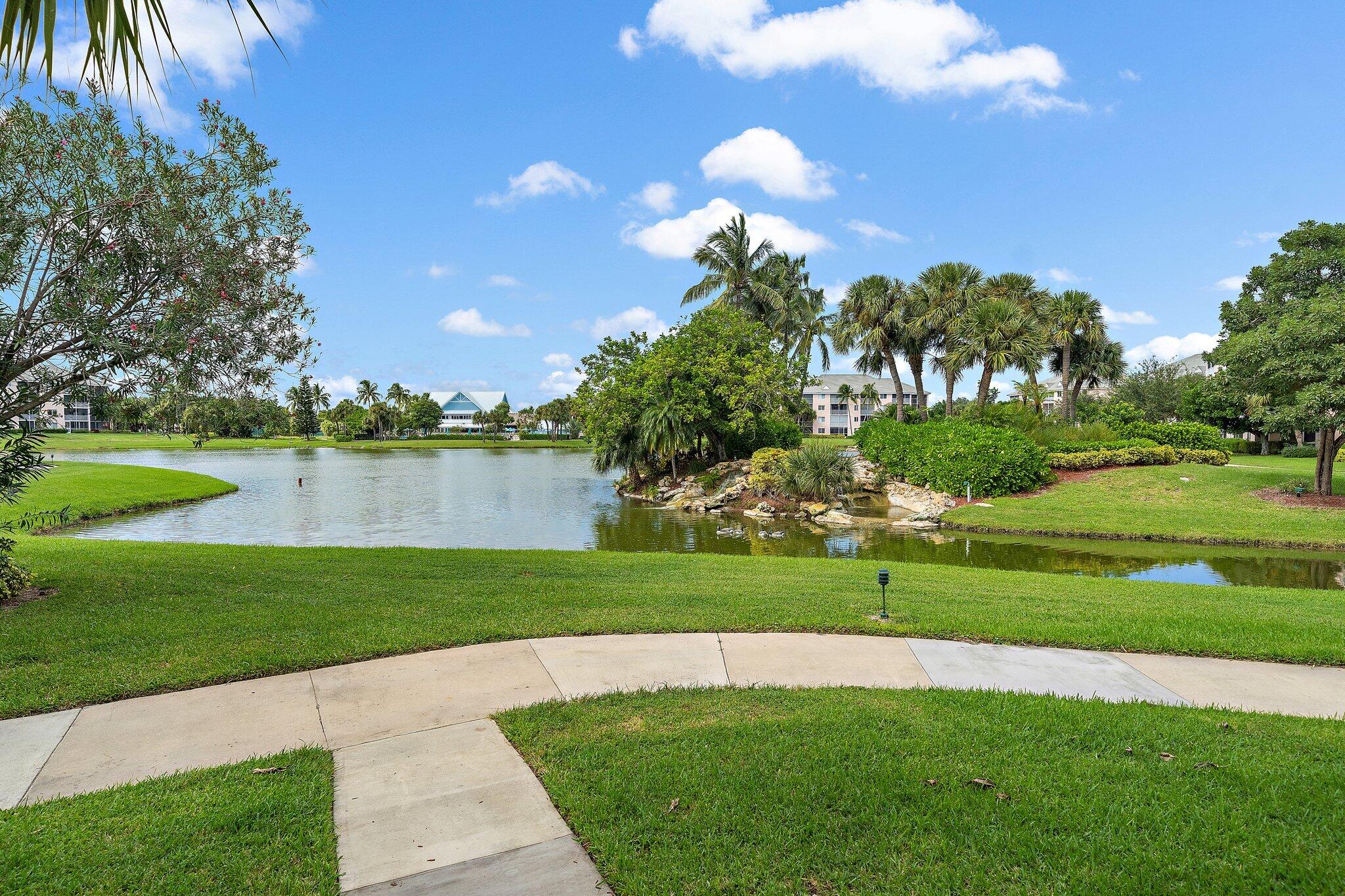 353 Highway 1, Unit D101 Jupiter, FL 33477 - Photo 3 of 32 a view of a golf course with a lake