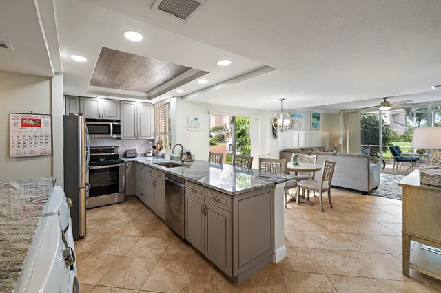 a kitchen with counter top space cabinets and stainless steel appliances