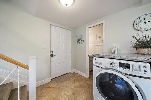 a view of a kitchen with washer and dryer