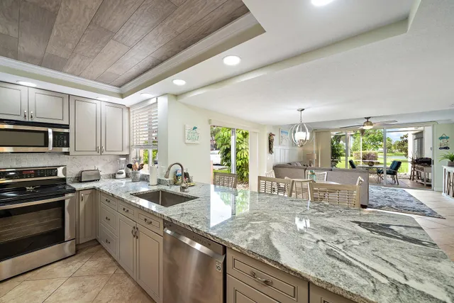 a kitchen with lots of counter top space and appliances