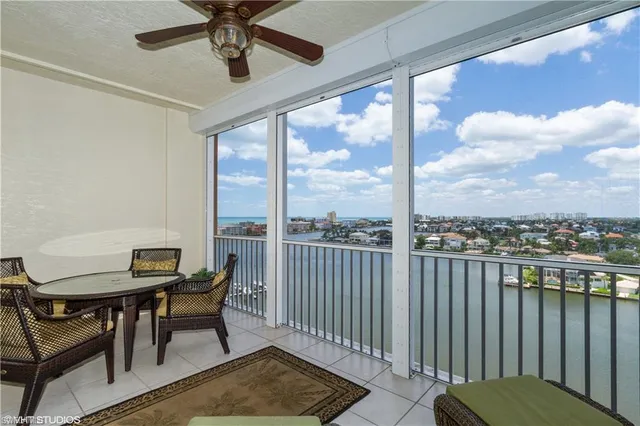 a view of a balcony with furniture