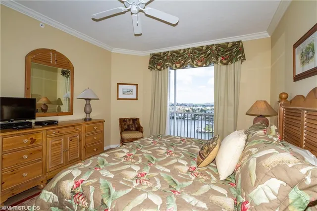 a bedroom with a bed and a television