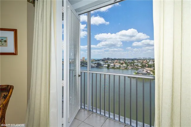 a view of a city from a corridor