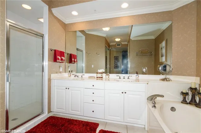 a bathroom with a sink vanity and a mirror