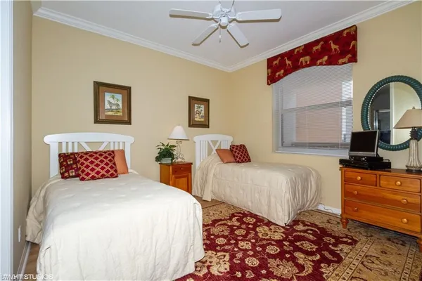 a bedroom with bed and a window