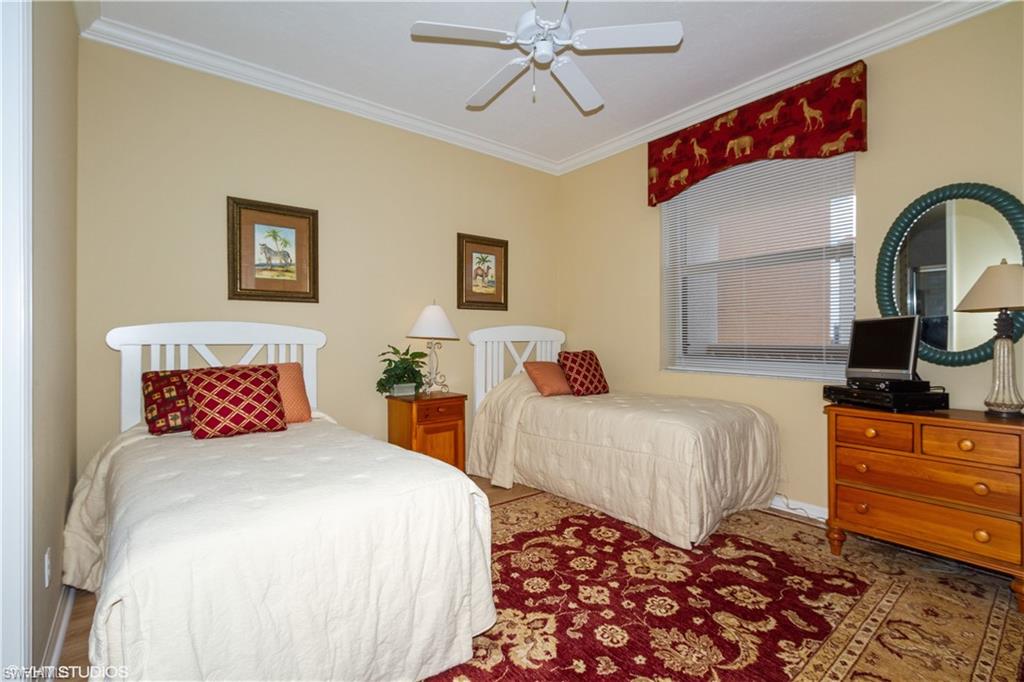 410 Flagship Drive, Unit 1105 Naples, FL 34108 - Photo 22 of 34 a bedroom with bed and a window