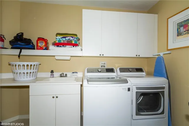 a utility room with dryer and washer