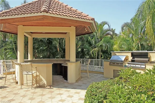 a view of a chairs and table in the patio