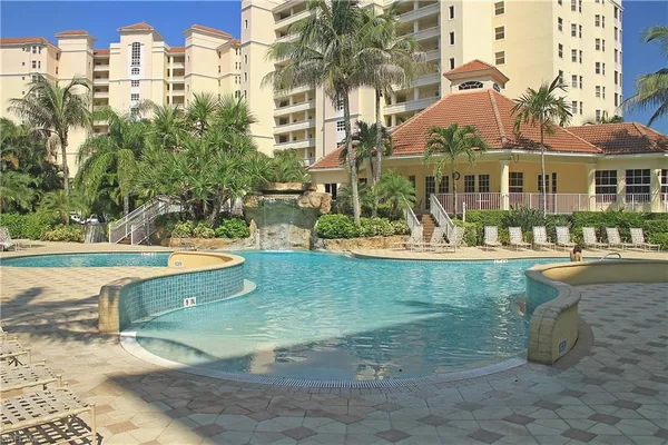 a view of a swimming pool with a patio