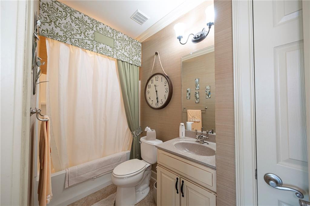 408 Independence Lane Freedom, PA 15042 - Photo 19 of 26 a bathroom with a toilet a sink and a shower curtain