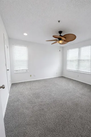 a workspace with furniture window and wooden floor