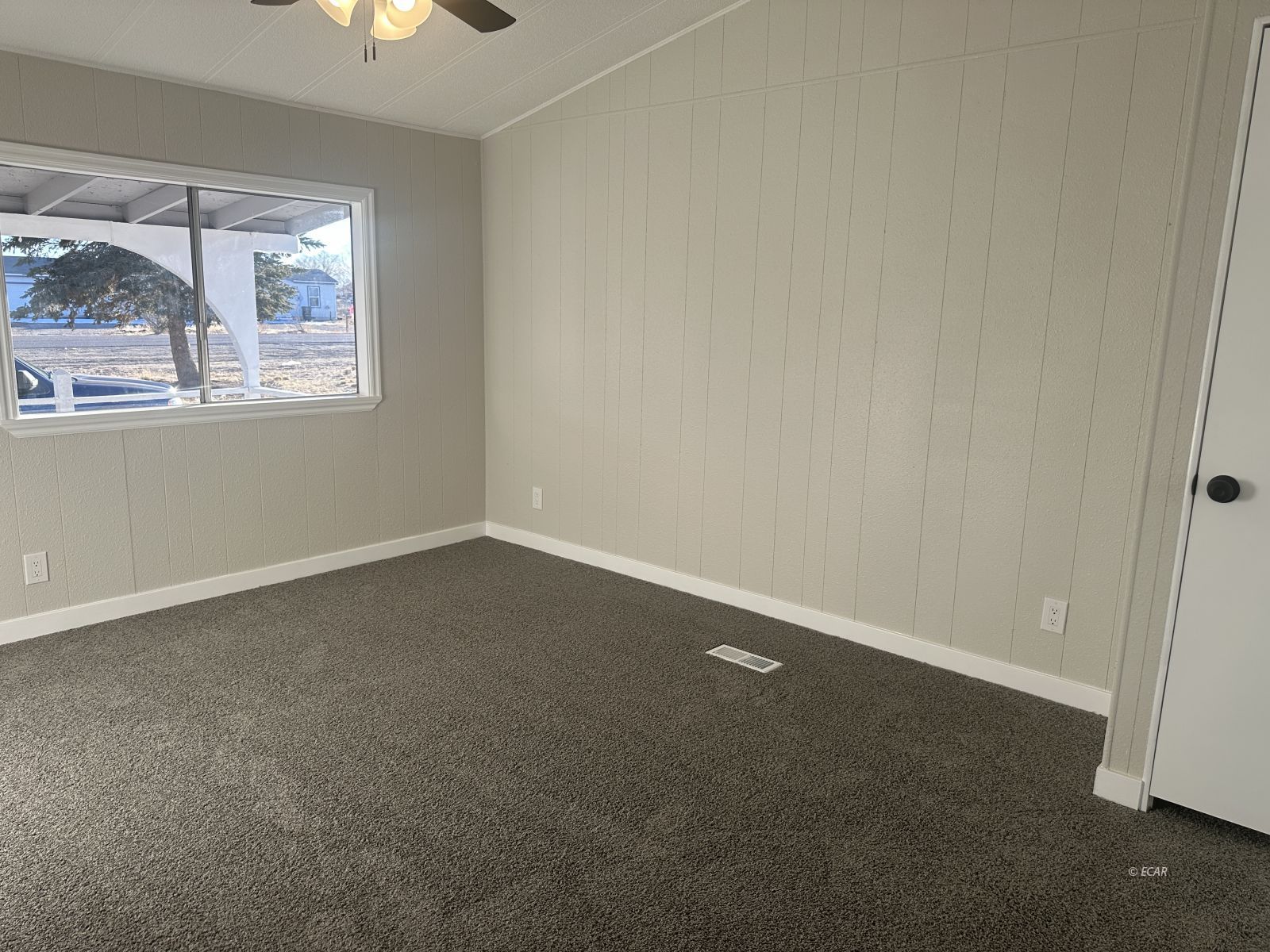 940 Spring Valley Parkway Spring Creek, NV 89815 - Photo 18 of 25 an empty room with a window