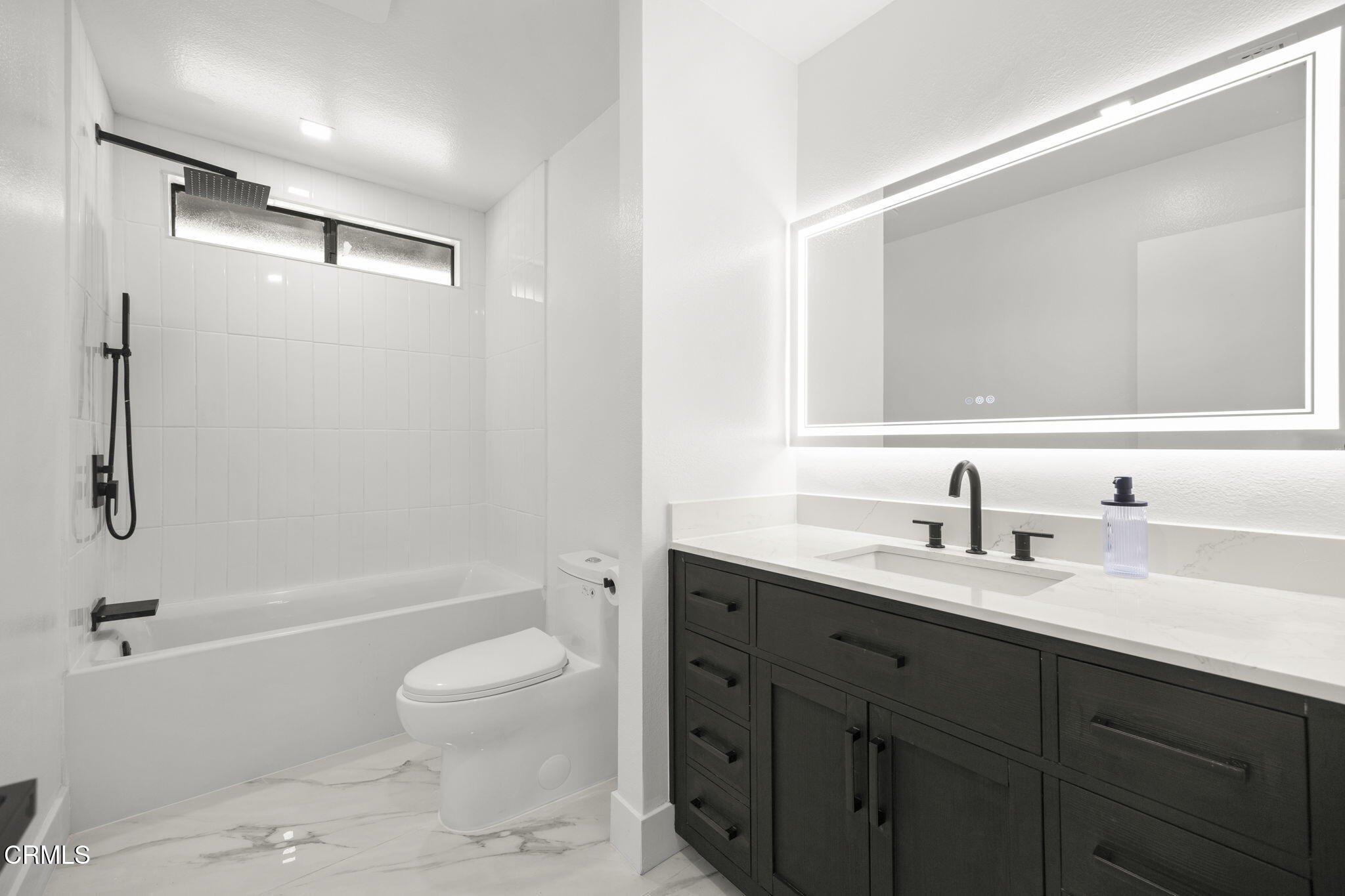 921 Juneberry Place Oxnard, CA 93036 - Photo 17 of 20 a bathroom with a granite countertop sink a toilet and shower