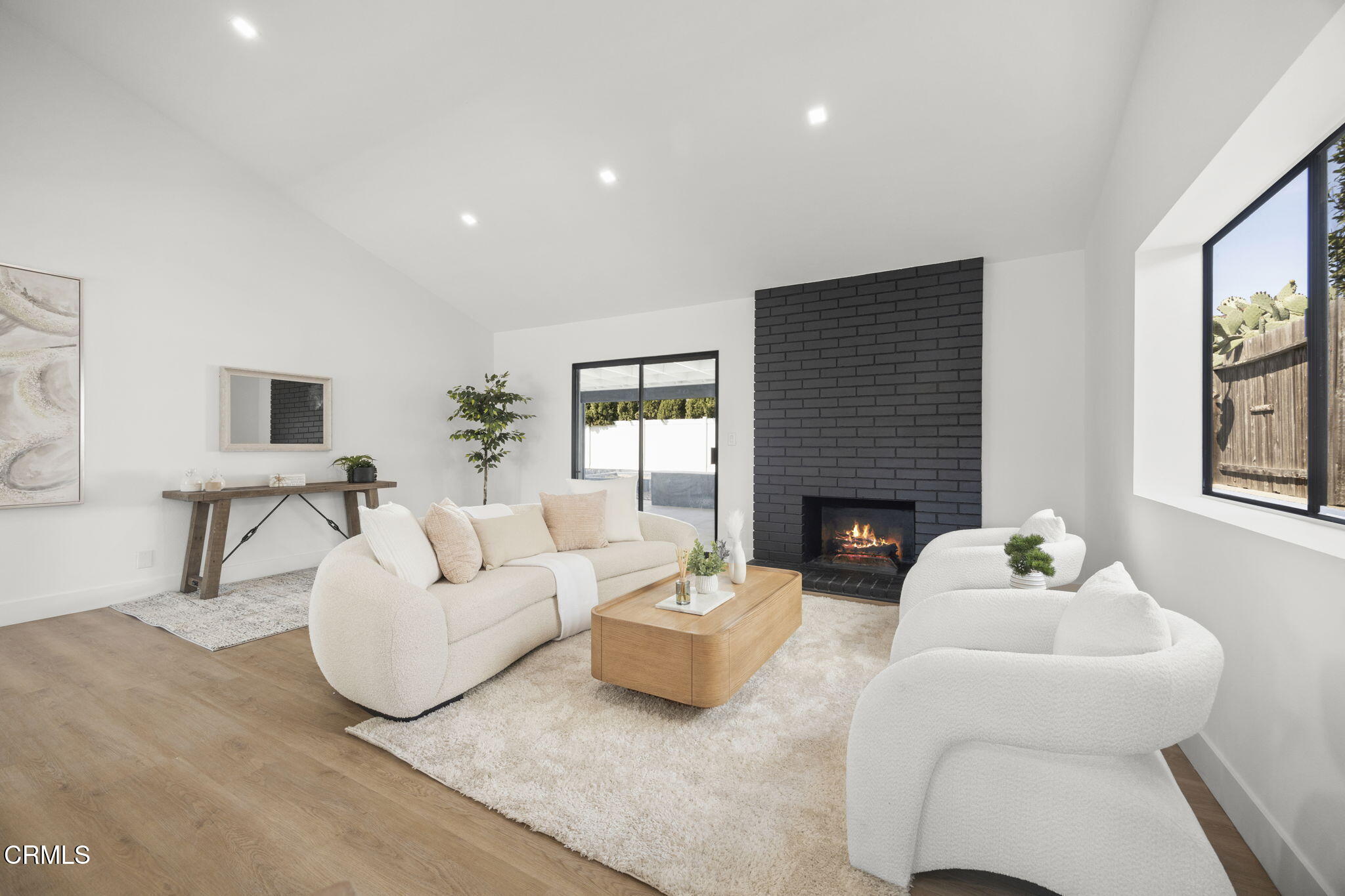 921 Juneberry Place Oxnard, CA 93036 - Photo 3 of 20 a living room with furniture a fireplace and window
