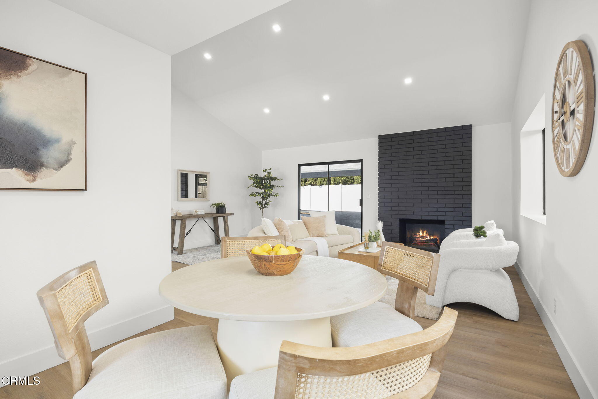 921 Juneberry Place Oxnard, CA 93036 - Photo 6 of 20 a living room with fireplace a couch and a table