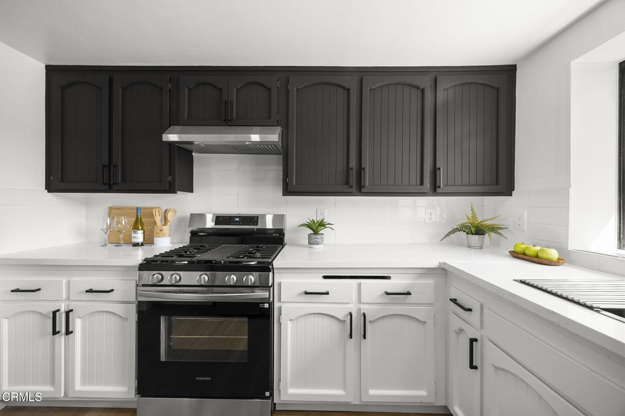 921 Juneberry Place Oxnard, CA 93036 - Photo 7 of 20 a kitchen with white cabinets and appliances
