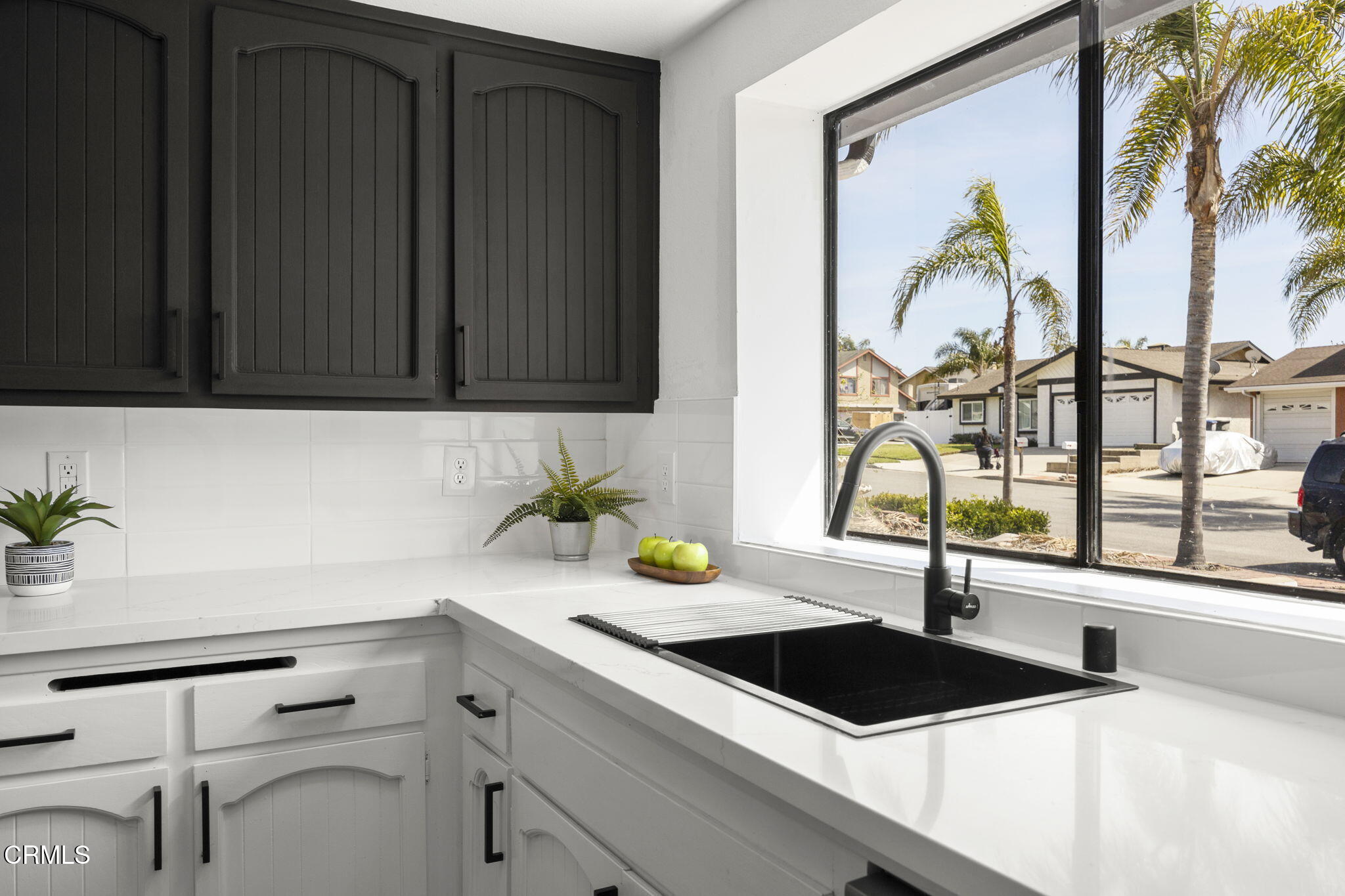 921 Juneberry Place Oxnard, CA 93036 - Photo 8 of 20 a kitchen with a refrigerator and a sink