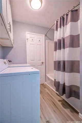 a bathroom with a sink a toilet and a shower