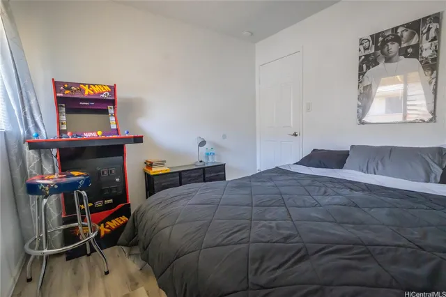 a bed room with a bed and a television