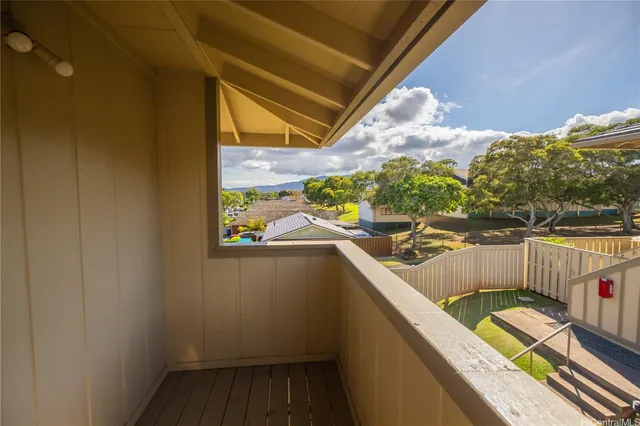 a view of balcony with wooden floor