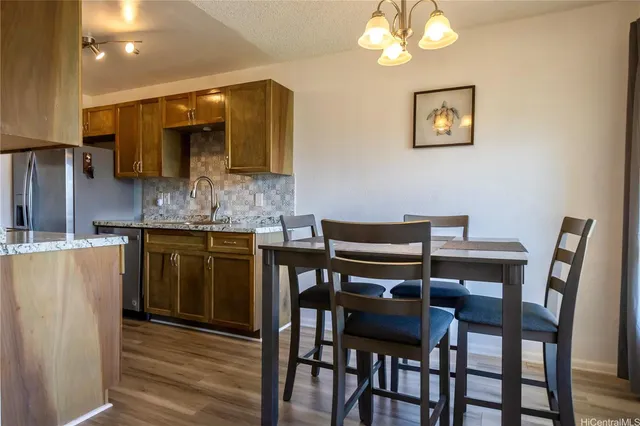 a kitchen with a table and chairs in it