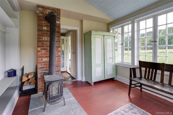 a living room with furniture and a book shelf