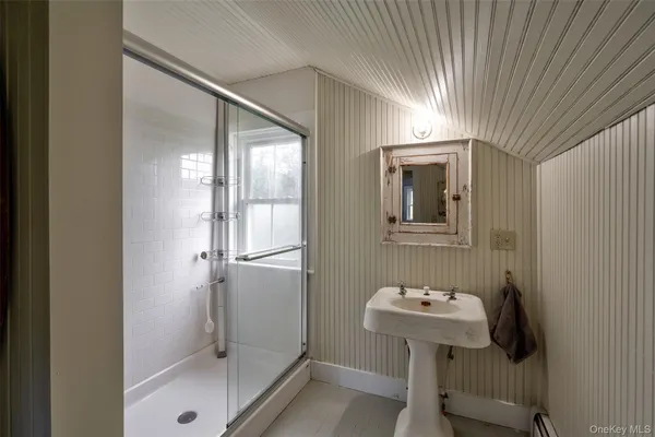 a bathroom with a sink a vanity and mirror