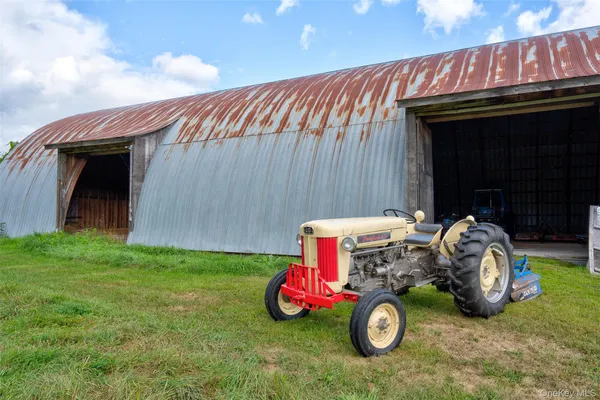 a view of a golf course with an ocean