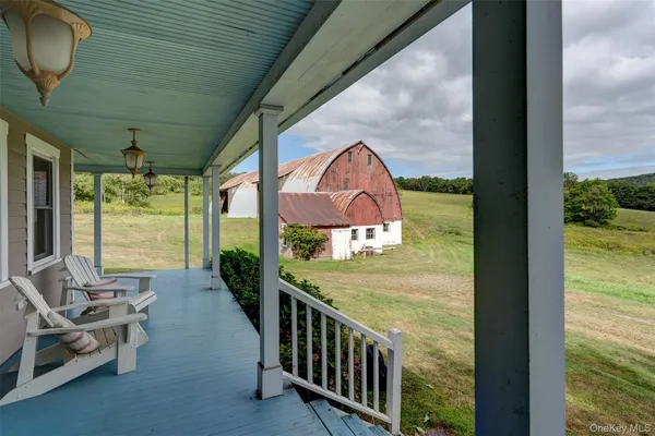 a view of a porch with furniture