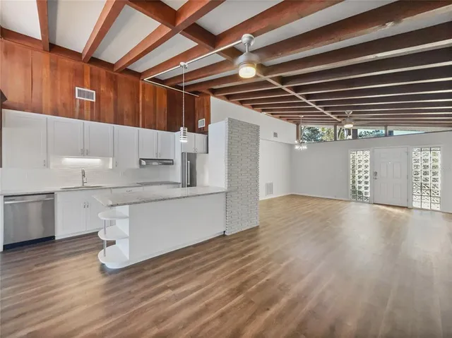 a kitchen with a sink and cabinets