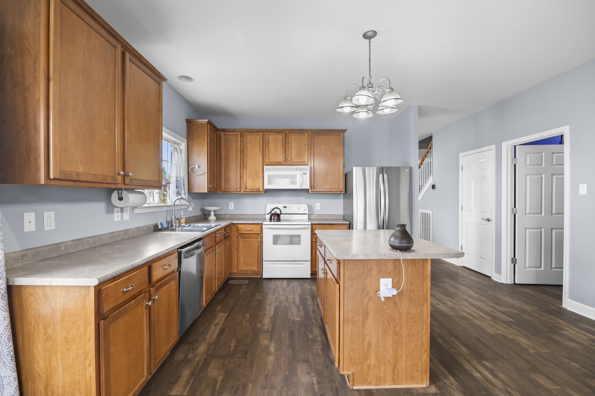 1305 Decatur Circle Franklin, TN 37067 - Photo 17 of 29 a large kitchen with stainless steel appliances granite countertop a sink refrigerator and cabinets
