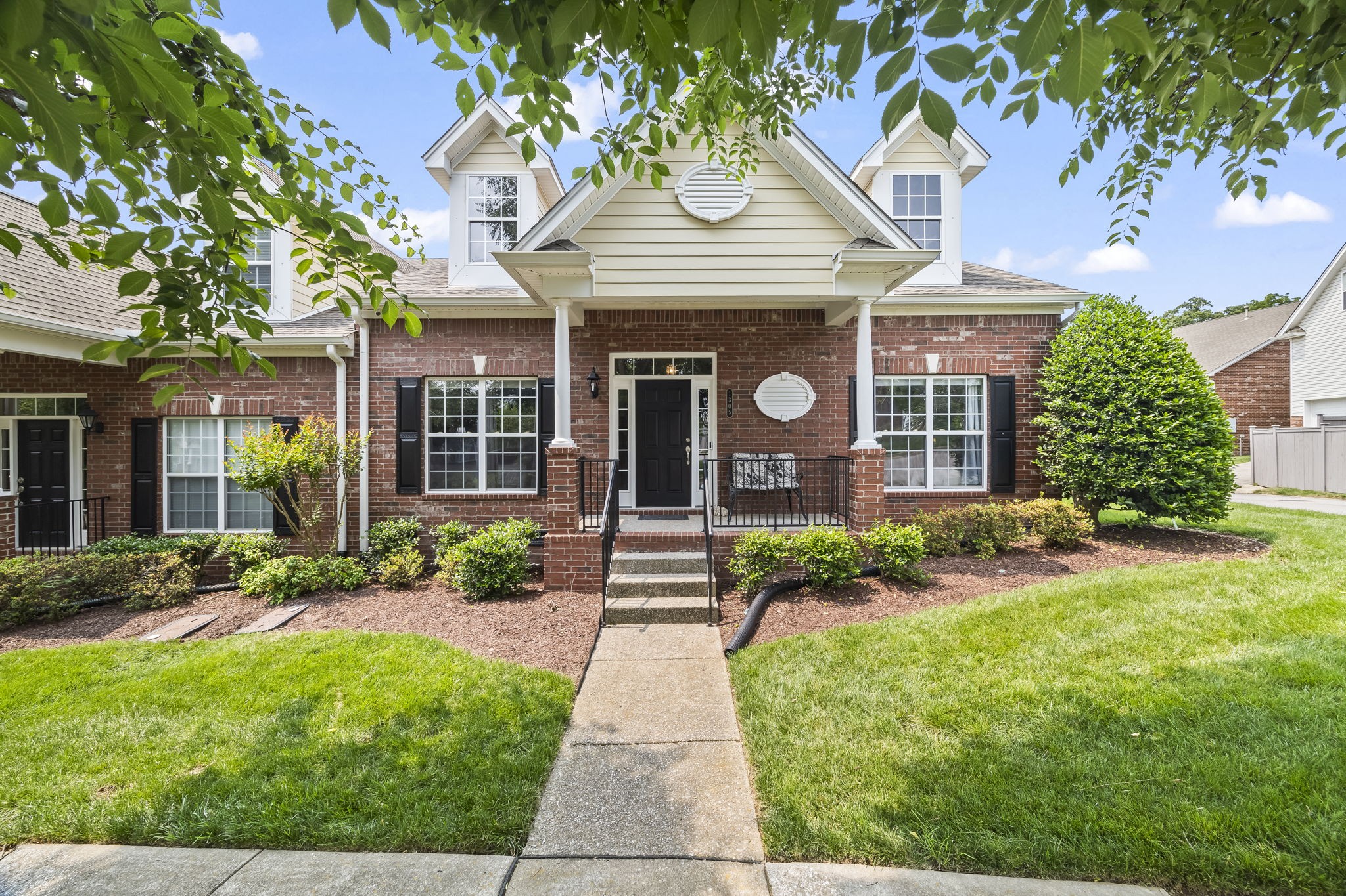 1305 Decatur Circle Franklin, TN 37067 - Photo 2 of 29 a front view of a house with garden and plants
