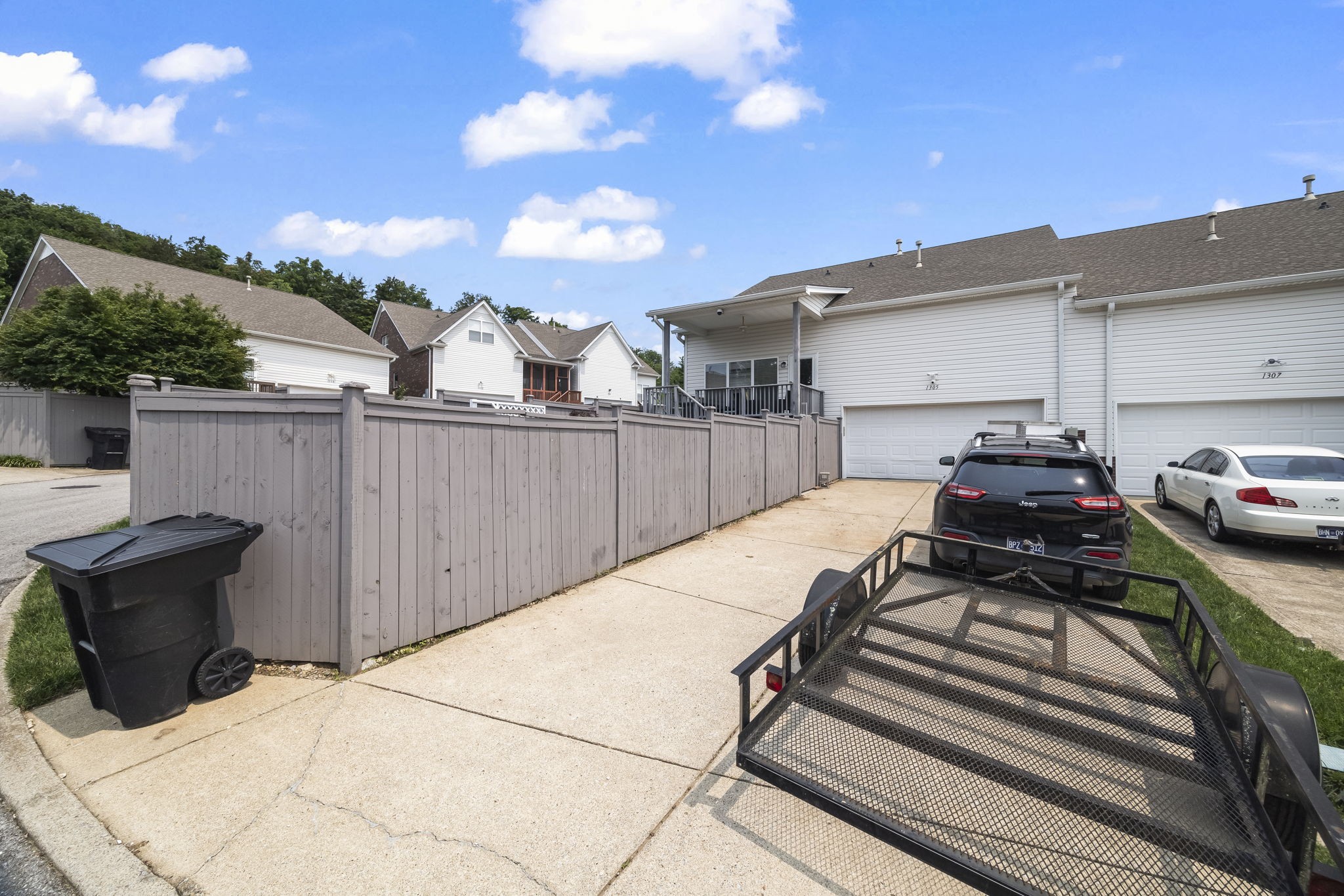 1305 Decatur Circle Franklin, TN 37067 - Photo 27 of 29 a view of a patio with table and chairs with wooden floor and fence