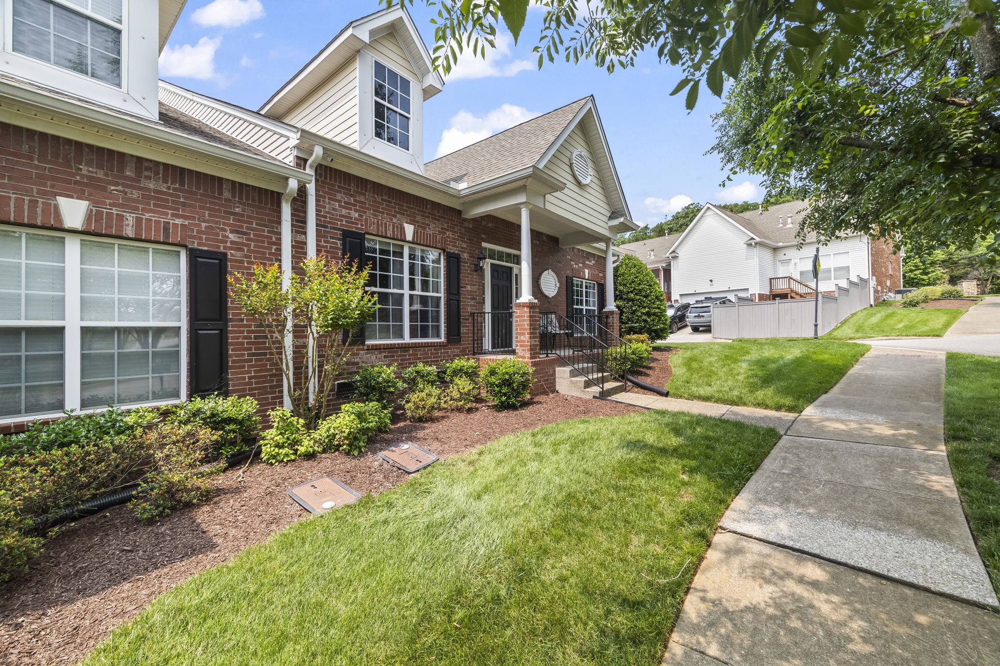 1305 Decatur Circle Franklin, TN 37067 - Photo 3 of 29 a front view of a house with a yard and potted plants
