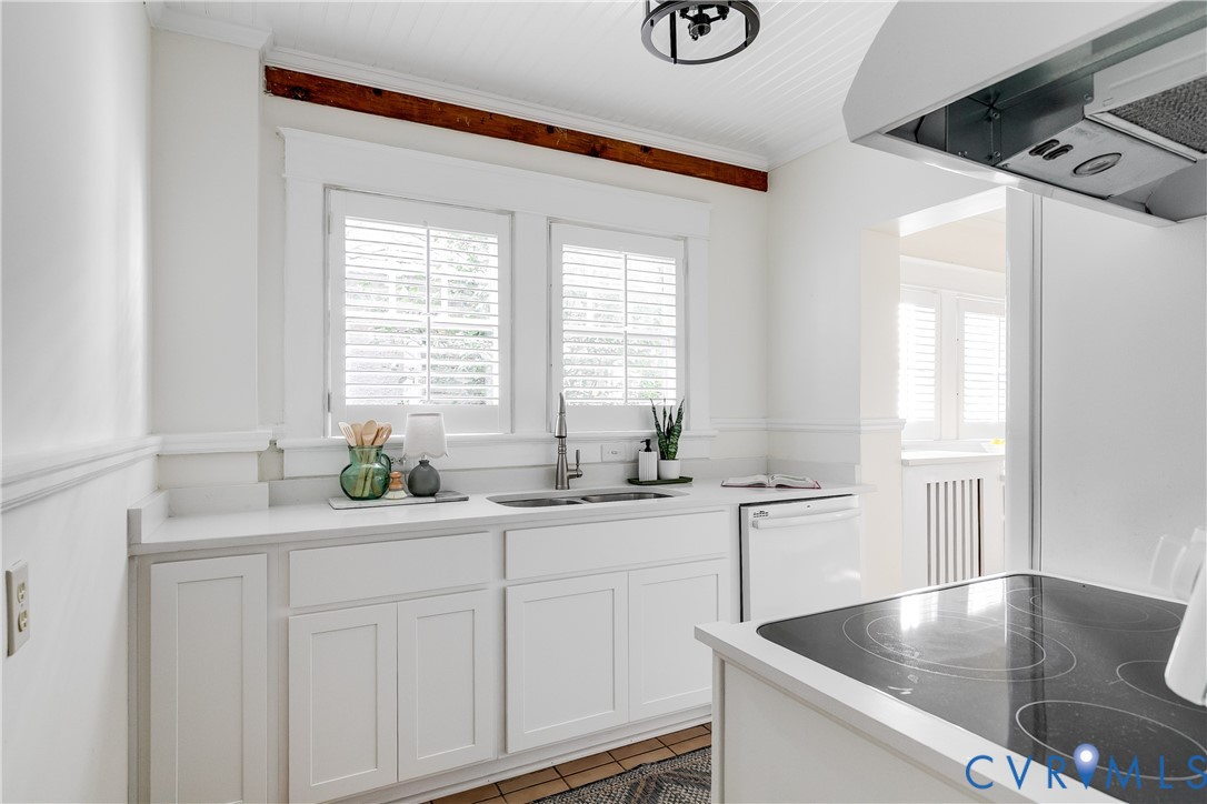 4808 Stuart Avenue Richmond, VA 23226 - Photo 12 of 41 a kitchen with granite countertop a sink a window and cabinets