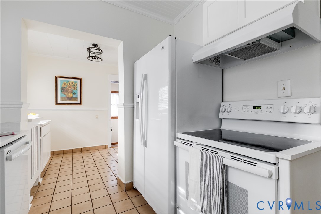 4808 Stuart Avenue Richmond, VA 23226 - Photo 15 of 41 a kitchen with white cabinets and white appliances