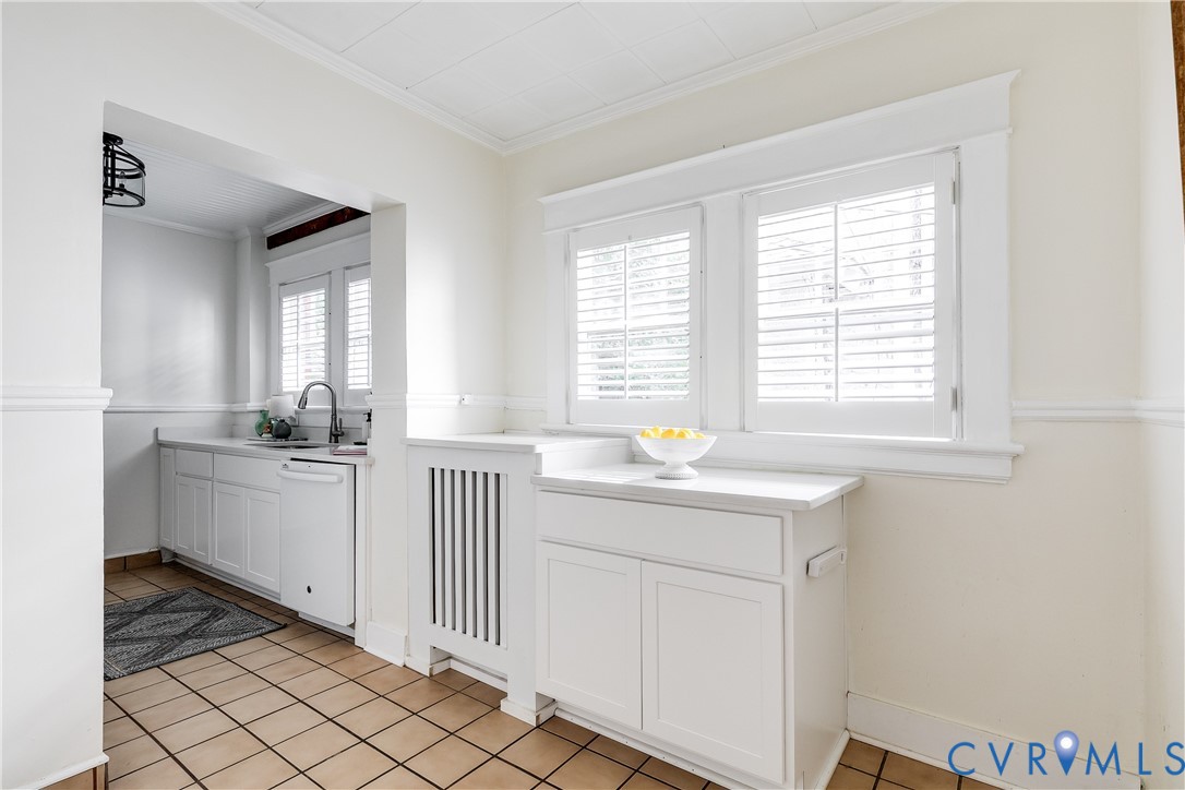 4808 Stuart Avenue Richmond, VA 23226 - Photo 17 of 41 a kitchen with a sink cabinets and window