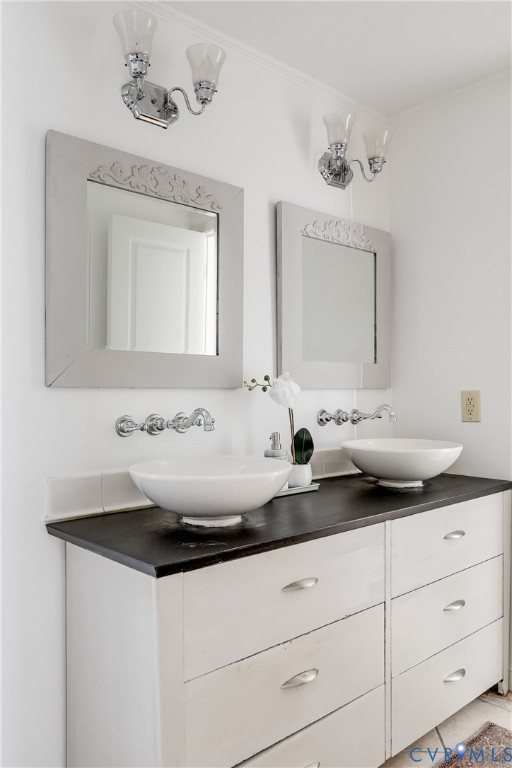 4808 Stuart Avenue Richmond, VA 23226 - Photo 29 of 41 a bathroom with a sink and a mirror