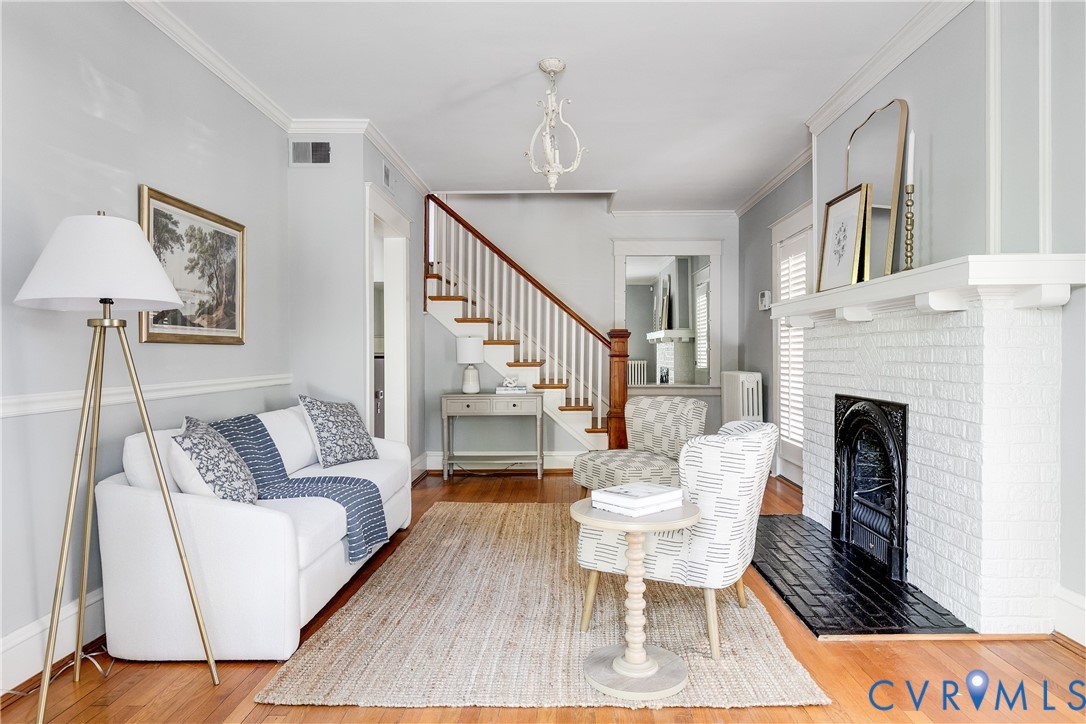 4808 Stuart Avenue Richmond, VA 23226 - Photo 3 of 41 a living room with furniture and a fireplace